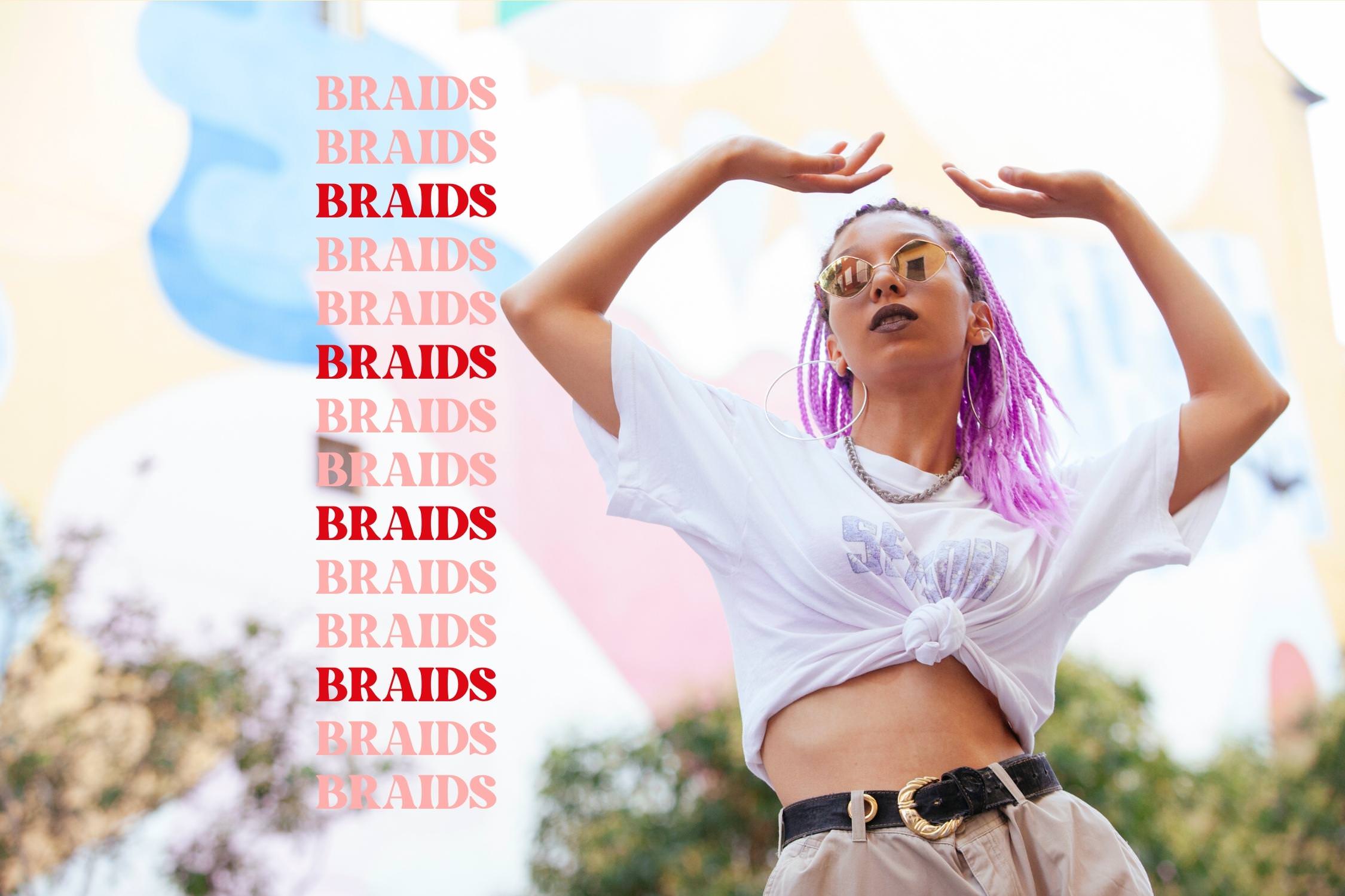 A girl stands outside with her arms up in the air. Her hair is done in short purple braids. She wears a white tshirt tied in a knot, beige pants and sunglasses. On the left is text that reads "Braids, Braids,Braids, Braids" all the way to the bottom of the image.   